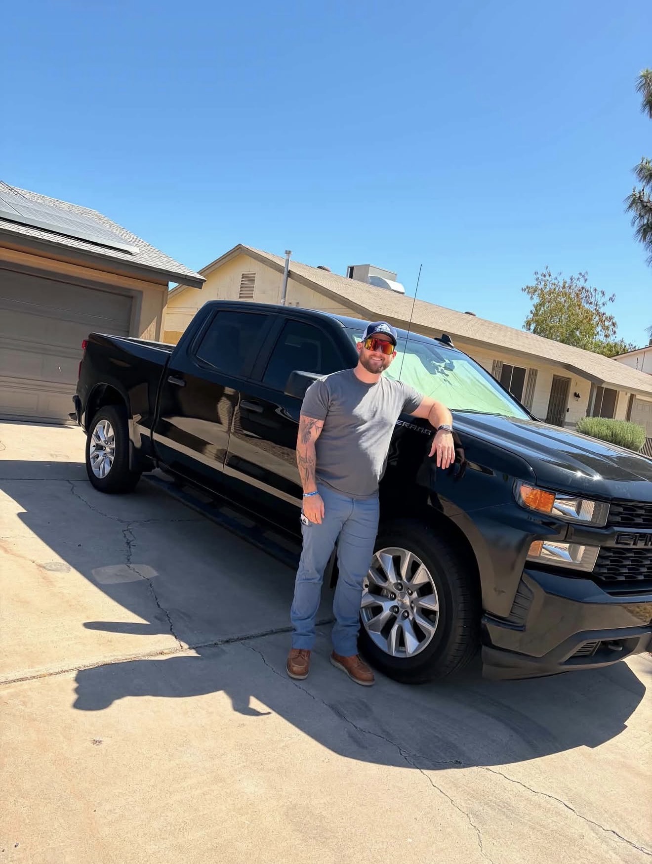 Client with black Chevrolet Silverado truck